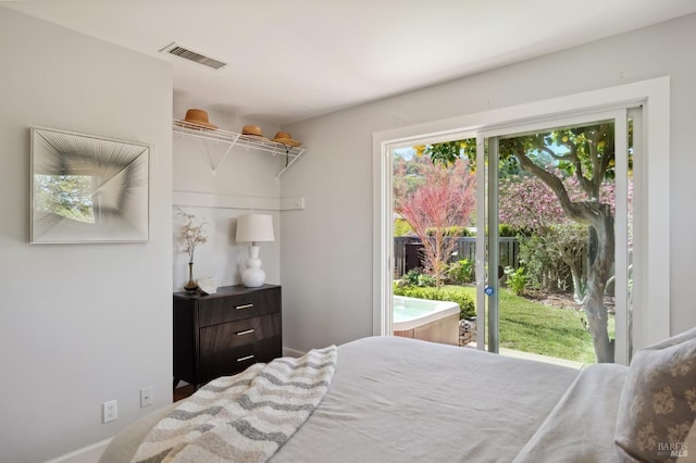 bedroom featuring visible vents and access to outside