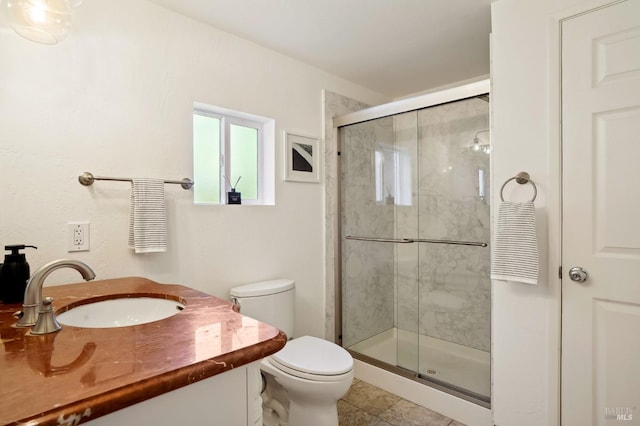 full bath with a shower stall, toilet, and vanity