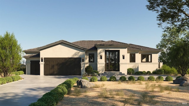 view of front of home with stucco siding, concrete driveway, and an attached garage
