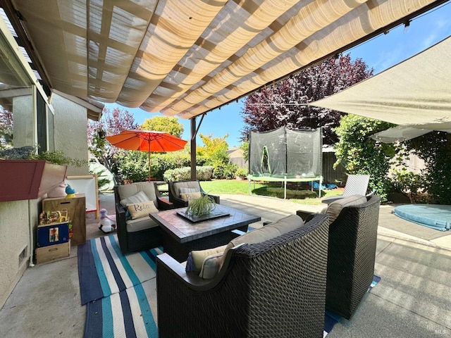 view of patio featuring visible vents, a pergola, a trampoline, fence, and an outdoor hangout area