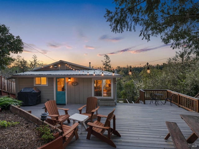 wooden deck with area for grilling