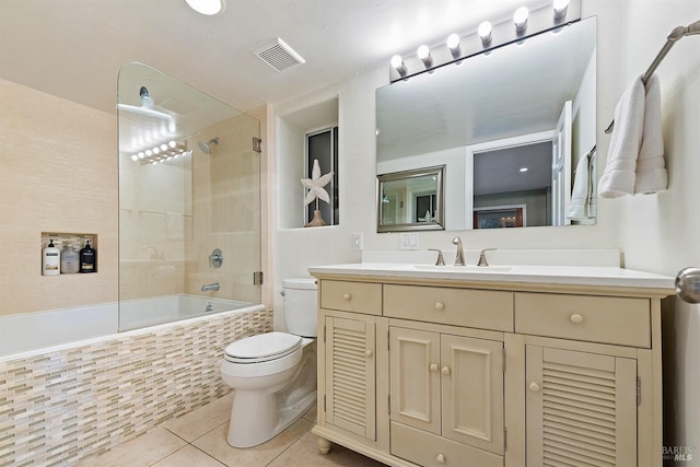 full bath with tile patterned flooring, visible vents, toilet, tiled shower / bath combo, and vanity