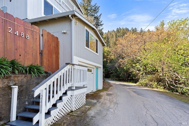 exterior space with driveway and a garage