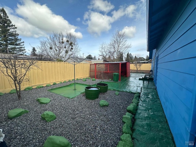 view of yard featuring a patio and a fenced backyard