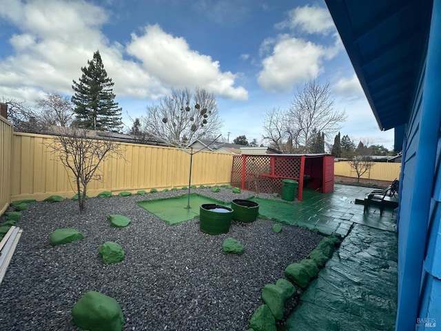 view of yard with a fenced backyard and a patio area