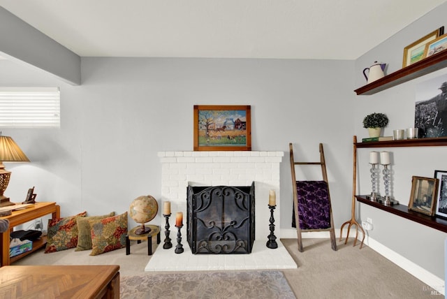 carpeted living room with a fireplace and baseboards