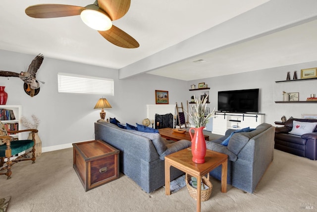living room featuring light colored carpet, ceiling fan, and baseboards