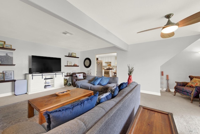 living room featuring visible vents, ceiling fan, baseboards, and carpet floors