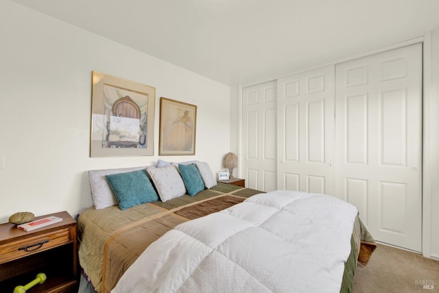 carpeted bedroom with a closet