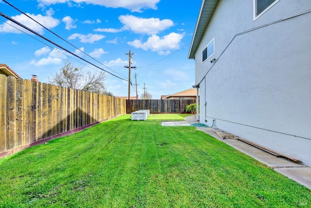 view of yard with a fenced backyard