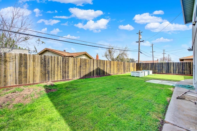view of yard with a fenced backyard