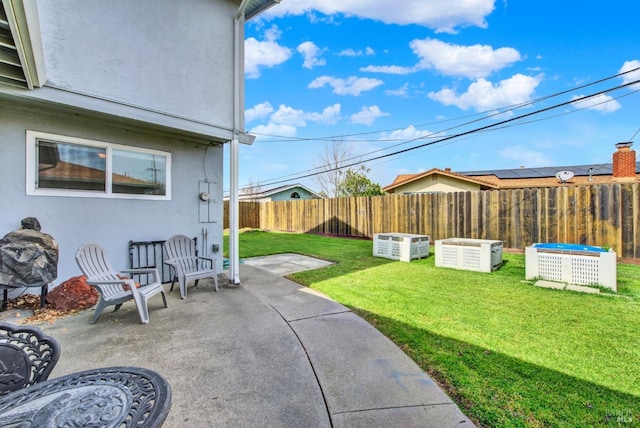 view of yard featuring a patio area and a fenced backyard