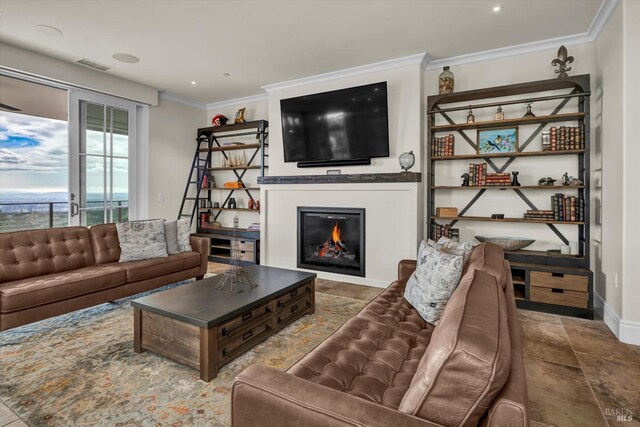 living room featuring crown molding, baseboards, a glass covered fireplace, and visible vents