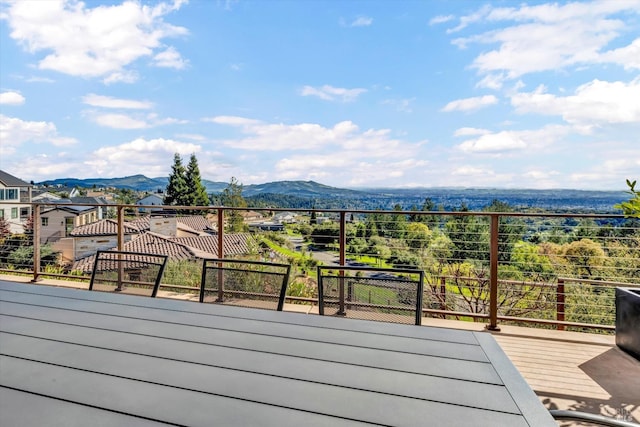 wooden deck with a mountain view