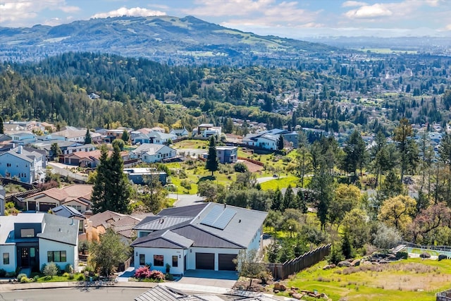 birds eye view of property featuring a mountain view and a residential view