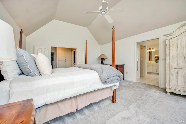 carpeted bedroom featuring ensuite bathroom, a ceiling fan, and lofted ceiling
