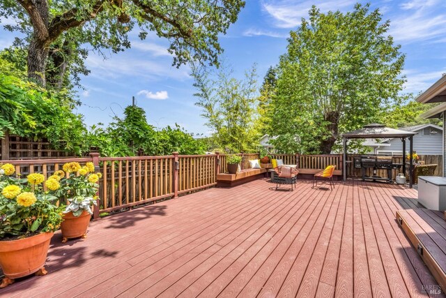 wooden terrace with a gazebo