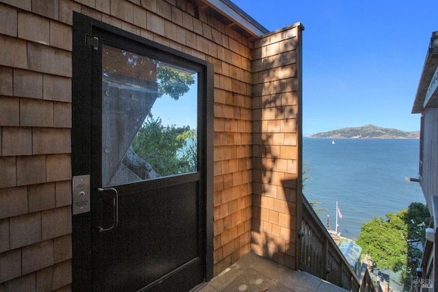 exterior space featuring a water and mountain view