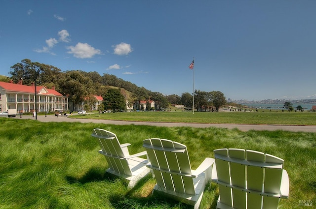 view of home's community featuring a lawn