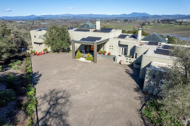 birds eye view of property with a mountain view