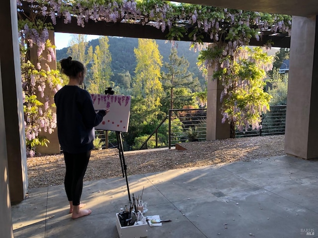 view of patio featuring a wooded view