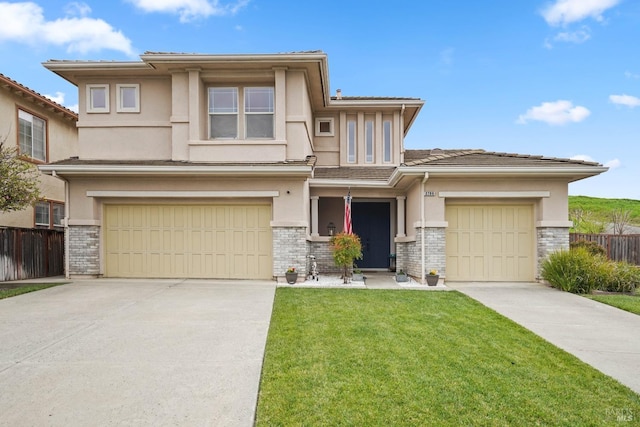 prairie-style home featuring fence, driveway, and stucco siding
