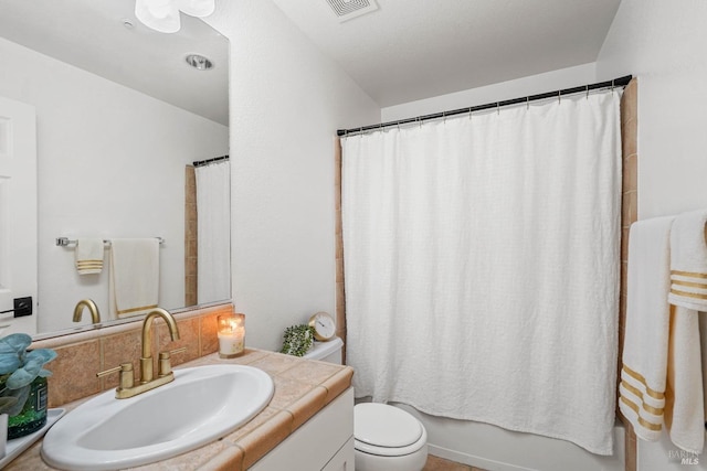 full bathroom featuring visible vents, shower / bath combination with curtain, toilet, and vanity