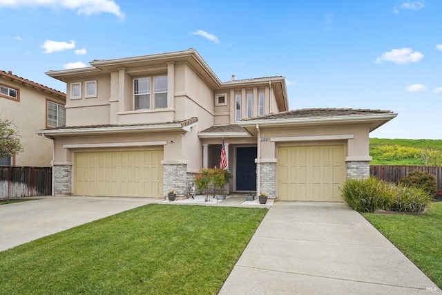 prairie-style house with stucco siding, concrete driveway, a front yard, and fence