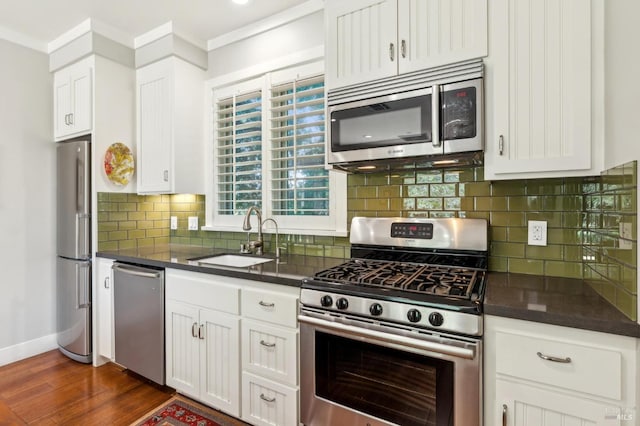 22 S Crane Ave, Saint Helena, CA 94574 - kitchen featuring a sink, white cabinetry, dark wood finished floors, baseboards, and appliances with stainless steel finishes