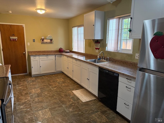 2024 San Luis St, Fairfield, CA 94533 - kitchen featuring freestanding refrigerator, dishwasher, a sink, range, and white cabinetry