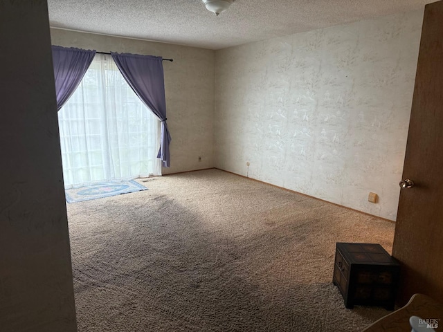 2024 San Luis St, Fairfield, CA 94533 - carpeted empty room with a textured wall and a textured ceiling