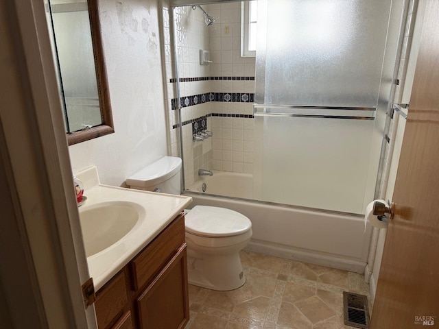 2024 San Luis St, Fairfield, CA 94533 - full bath with toilet, shower / bath combination with glass door, vanity, and tile patterned floors