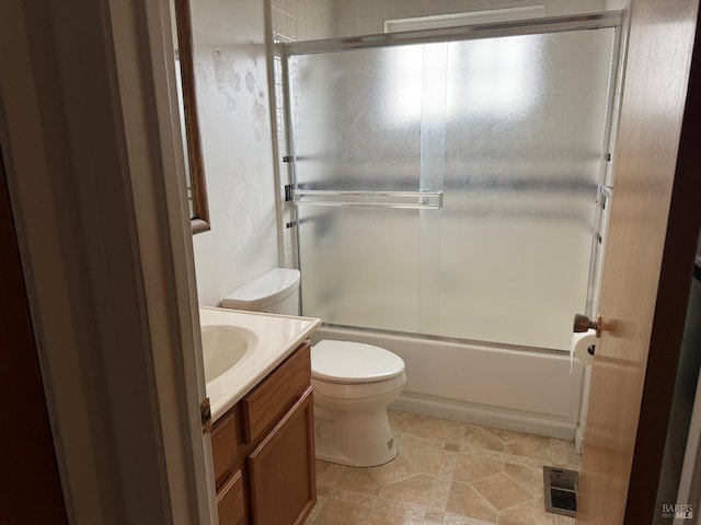 2024 San Luis St, Fairfield, CA 94533 - bathroom featuring toilet, vanity, combined bath / shower with glass door, and tile patterned flooring