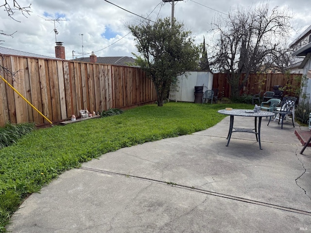 2024 San Luis St, Fairfield, CA 94533 - view of patio with a storage unit and an outbuilding