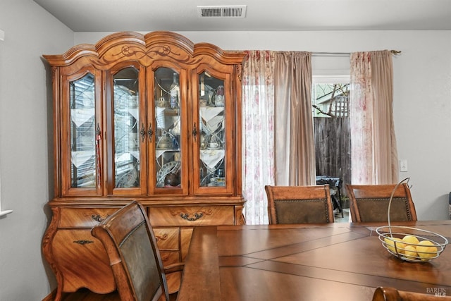 dining area featuring visible vents