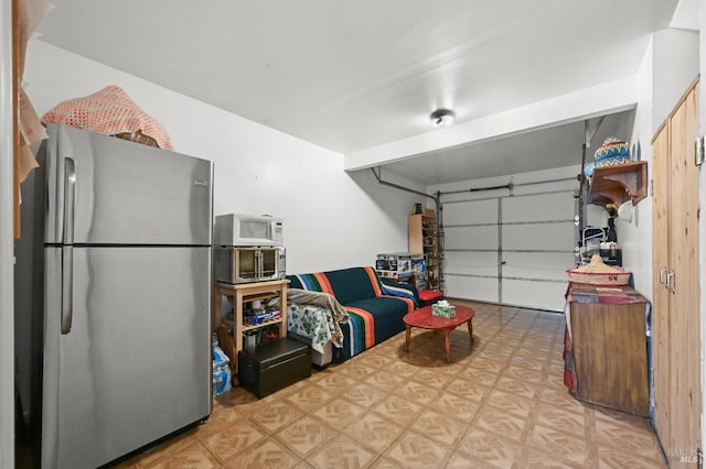garage featuring freestanding refrigerator