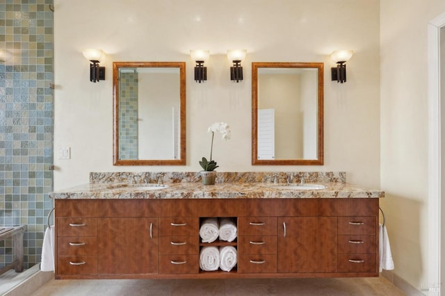 bathroom featuring double vanity and a sink