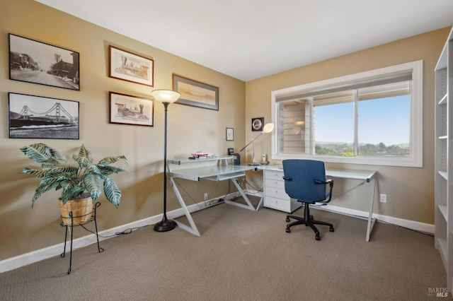 carpeted office featuring baseboards