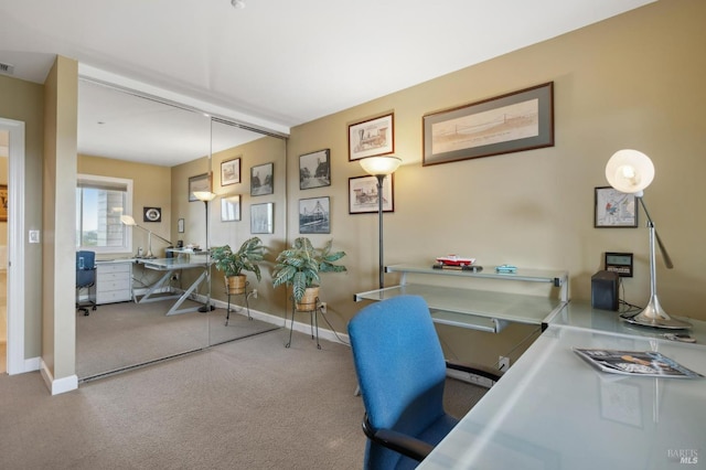 home office with carpet flooring, visible vents, and baseboards