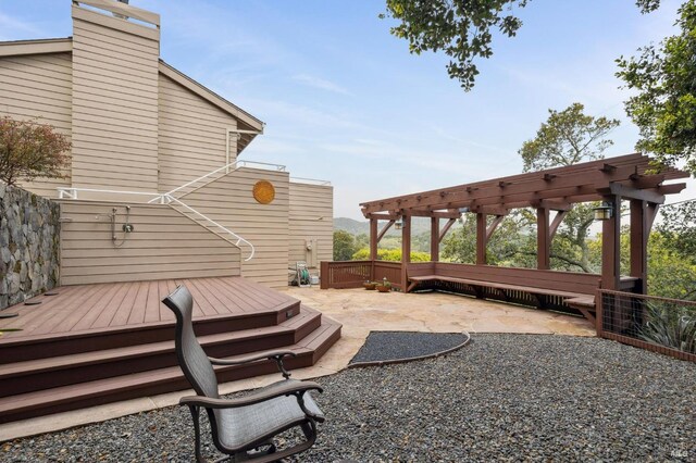 view of yard with a wooden deck and a patio area