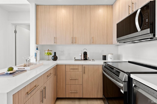 45 Harbor Oak Dr Unit 35, Tiburon, CA 94920 - kitchen featuring appliances with stainless steel finishes, light brown cabinets, and light countertops