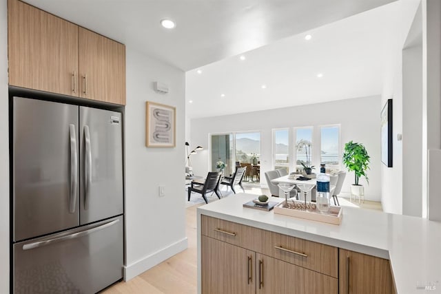 45 Harbor Oak Dr Unit 35, Tiburon, CA 94920 - kitchen featuring light countertops, recessed lighting, light wood-style flooring, freestanding refrigerator, and modern cabinets