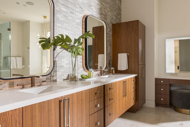 full bathroom with tile patterned floors, decorative backsplash, double vanity, and a sink