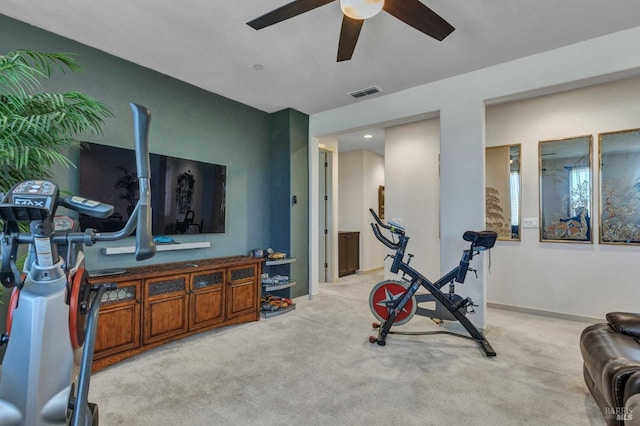 exercise area featuring ceiling fan, baseboards, visible vents, and carpet