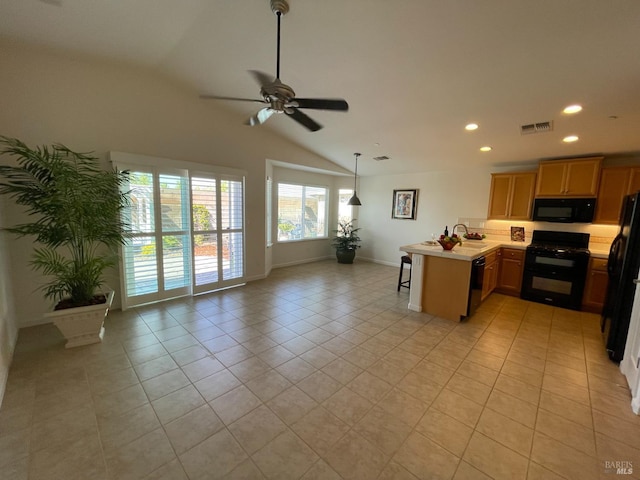 501 Three Rivers Ct, Rio Vista, CA 94571 - kitchen featuring a ceiling fan, a peninsula, open floor plan, black appliances, and light countertops