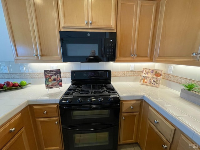 501 Three Rivers Ct, Rio Vista, CA 94571 - kitchen with backsplash, black appliances, and tile countertops