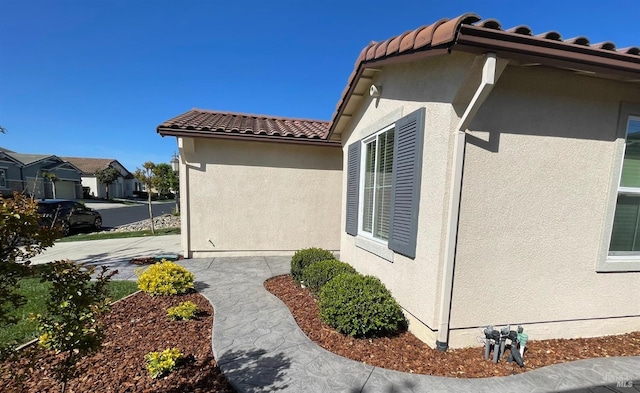 501 Three Rivers Ct, Rio Vista, CA 94571 - view of side of property with a tile roof, stucco siding, and a residential view