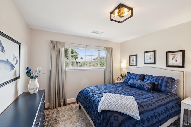 bedroom with visible vents and baseboards