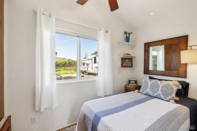 bedroom featuring lofted ceiling and ceiling fan