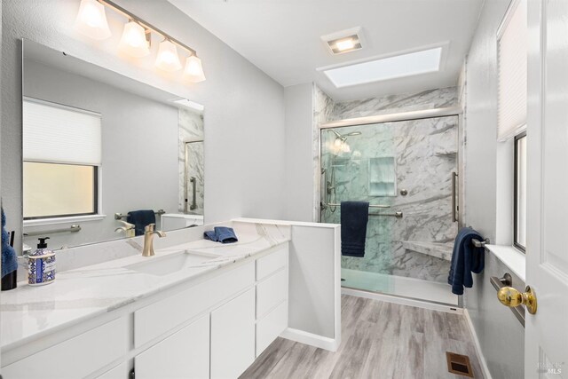 43 Fountain Grove Cir, Napa, CA 94558 - full bath featuring a marble finish shower, wood finished floors, vanity, and baseboards